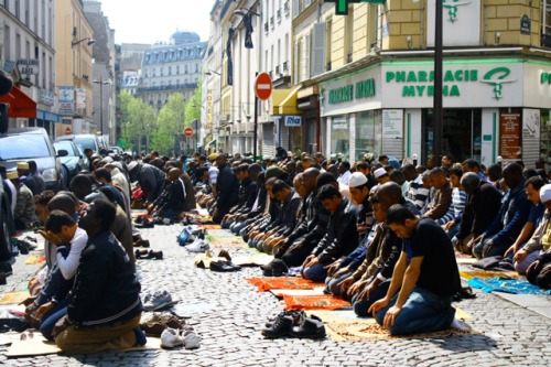 Myrha Street is part of the Arab/African immigrant quarter of Paris and is barricaded on Fridays to allow Muslims to pray in the street